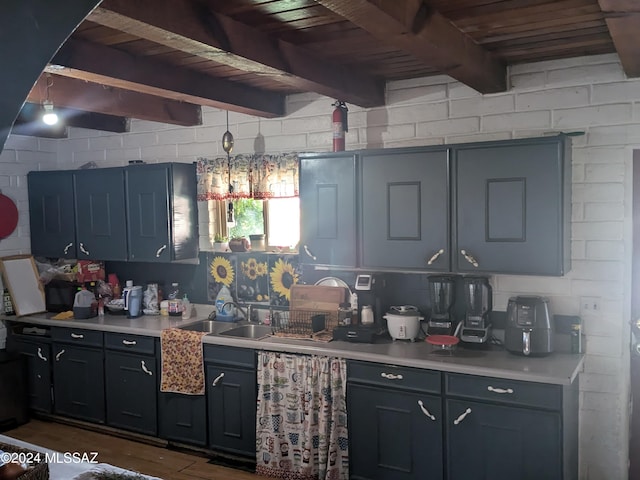 kitchen with sink, dark hardwood / wood-style floors, wooden ceiling, and beam ceiling