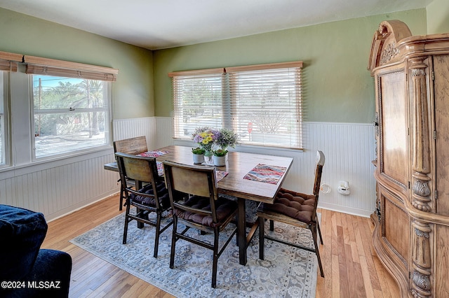 dining area featuring plenty of natural light and light hardwood / wood-style flooring