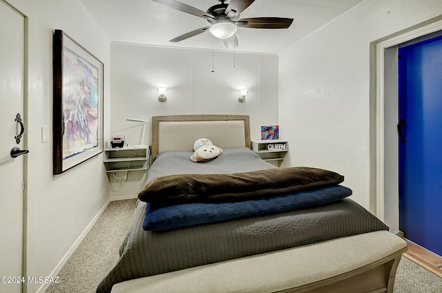 bedroom featuring ornamental molding, ceiling fan, and carpet flooring