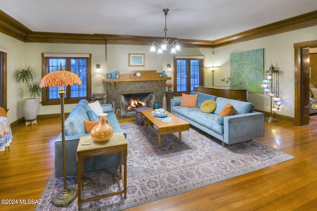 living room with ornamental molding and hardwood / wood-style floors