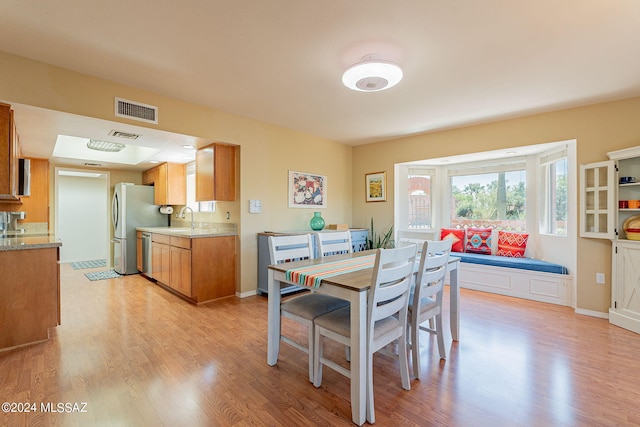 dining area with light hardwood / wood-style floors