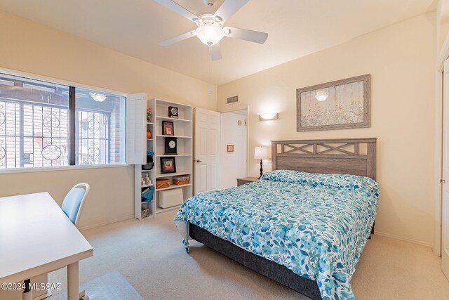 carpeted bedroom featuring ceiling fan