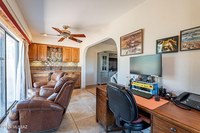 home office with ceiling fan and light tile patterned flooring