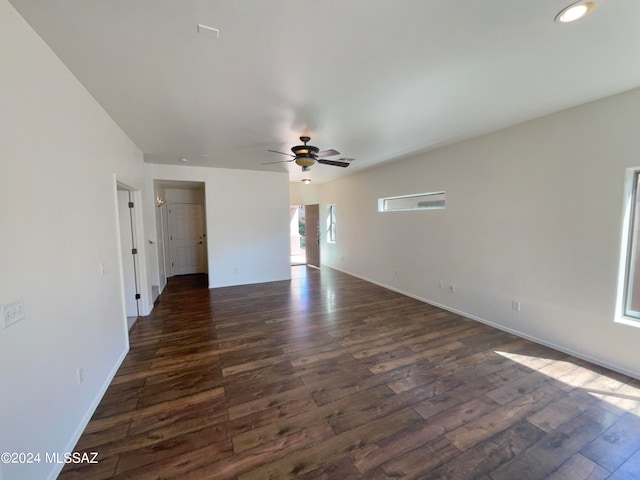 interior space with ceiling fan and dark hardwood / wood-style flooring