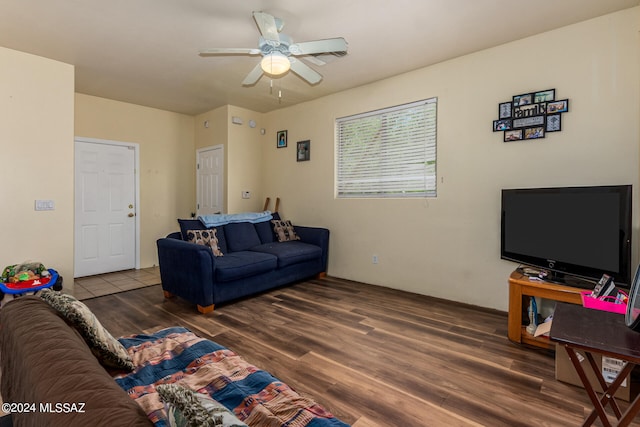 living room featuring ceiling fan and wood-type flooring