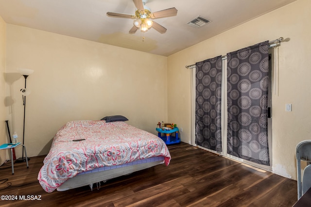 bedroom with hardwood / wood-style floors and ceiling fan