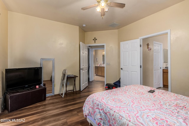 bedroom with ceiling fan, dark hardwood / wood-style floors, and ensuite bath