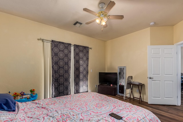 bedroom featuring ceiling fan and dark hardwood / wood-style flooring