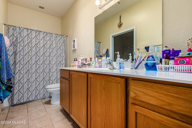 bathroom with tile patterned flooring, toilet, and vanity