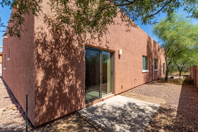 rear view of property featuring a patio area