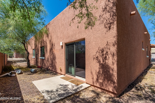 rear view of house featuring a patio