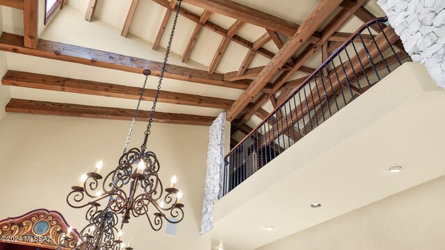 interior details with a notable chandelier and beam ceiling