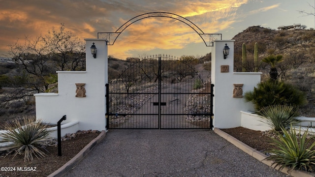 view of gate at dusk