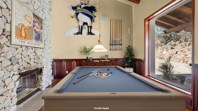 recreation room featuring wainscoting, tile patterned floors, pool table, and a fireplace