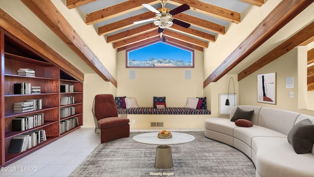living area with a ceiling fan, tile patterned flooring, vaulted ceiling with beams, and visible vents