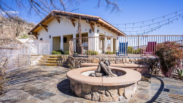 view of patio / terrace featuring a fire pit