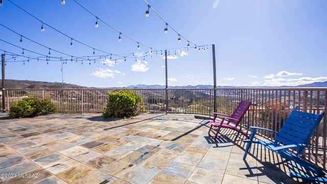 view of patio / terrace with a mountain view