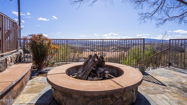 view of patio / terrace with a fire pit