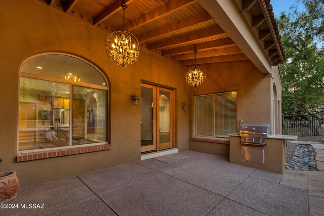 view of patio / terrace with grilling area, sink, and exterior kitchen