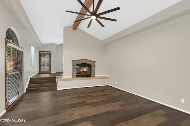 unfurnished living room with ceiling fan, lofted ceiling with beams, and dark hardwood / wood-style flooring