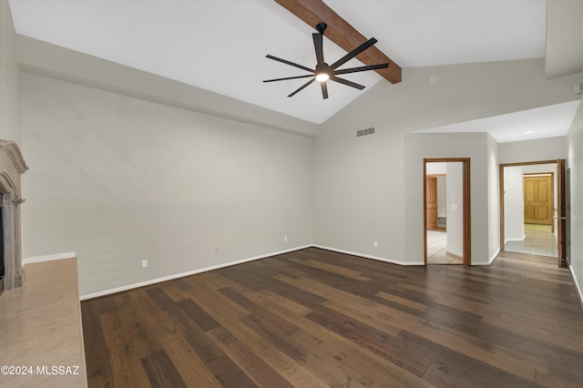 empty room with beam ceiling, dark hardwood / wood-style flooring, ceiling fan, and high vaulted ceiling