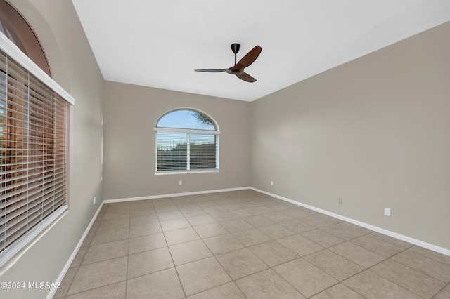 unfurnished room featuring ceiling fan and light tile patterned floors