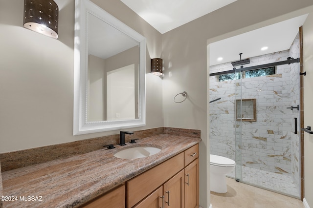 bathroom featuring vanity, toilet, tile patterned floors, and a shower with door