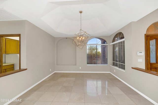 empty room featuring light tile patterned flooring and an inviting chandelier