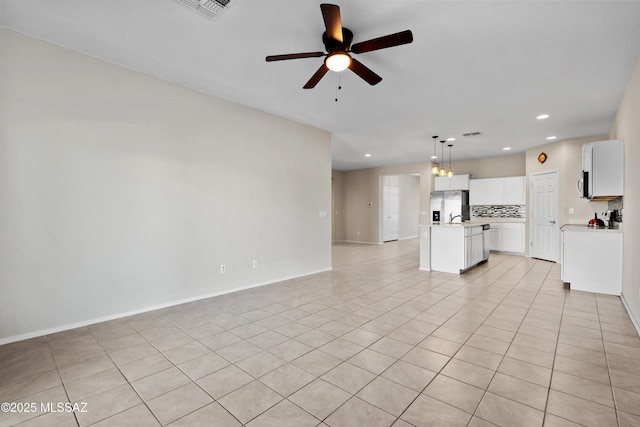 unfurnished living room featuring ceiling fan and light tile patterned flooring