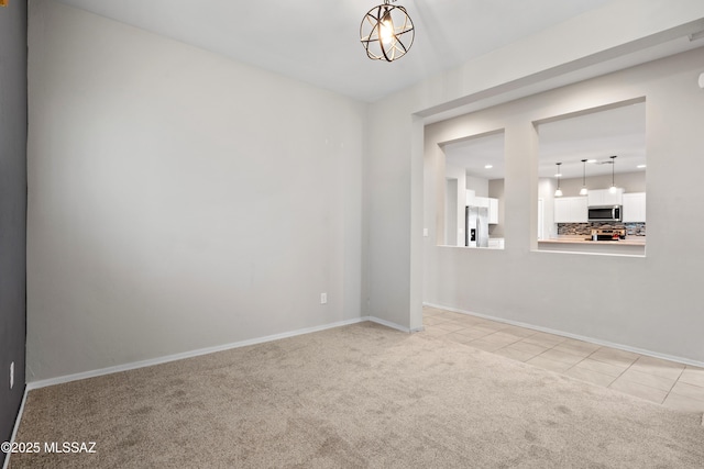 unfurnished room with light tile patterned floors