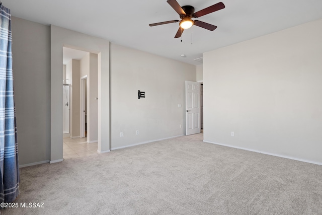 carpeted empty room featuring ceiling fan