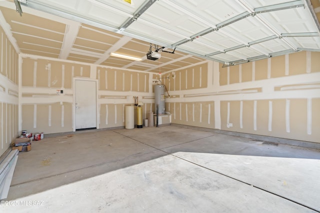 garage featuring water heater and a garage door opener