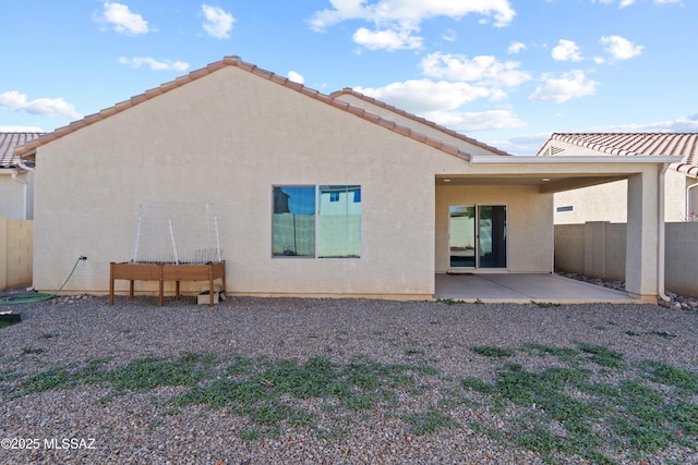 back of property featuring a patio area