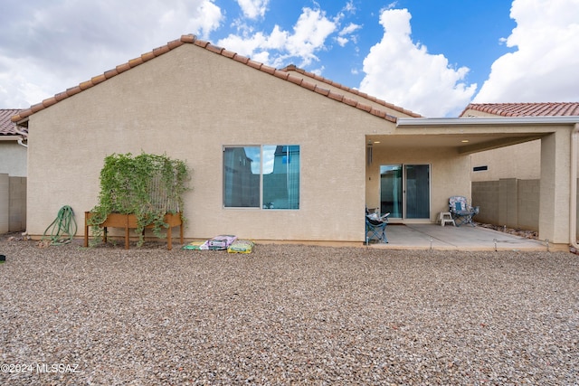 back of property with a patio area