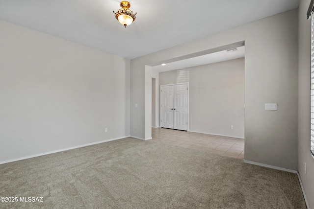 spare room featuring light tile patterned floors