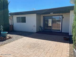 back of house with a patio