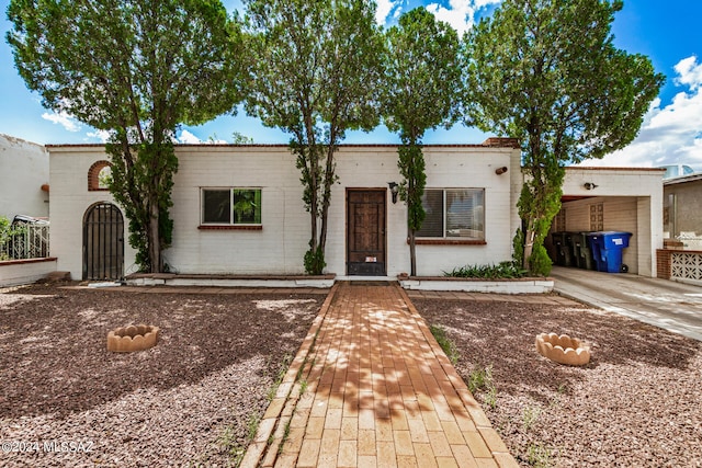 view of front of home with a carport