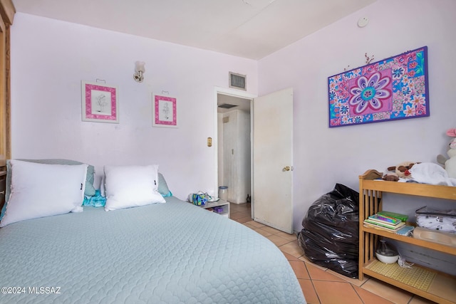 bedroom with light tile patterned floors