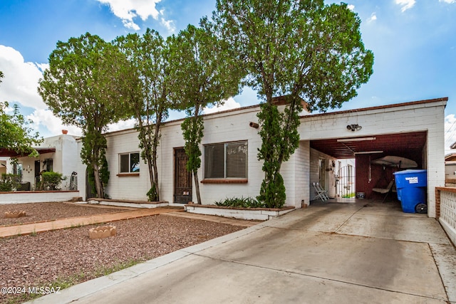 view of front of property with a carport