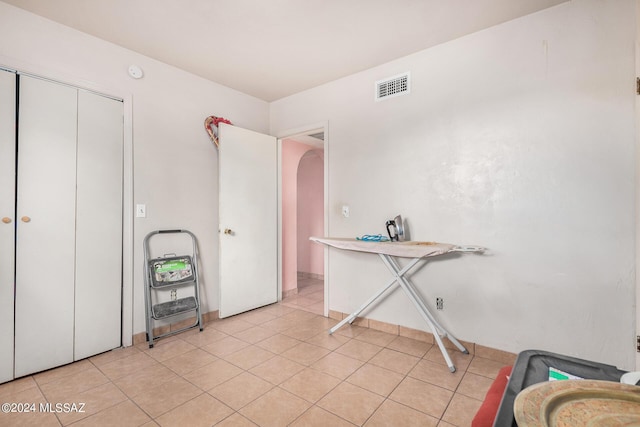 interior space featuring light tile patterned floors