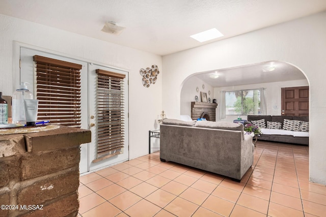 tiled living room with a textured ceiling