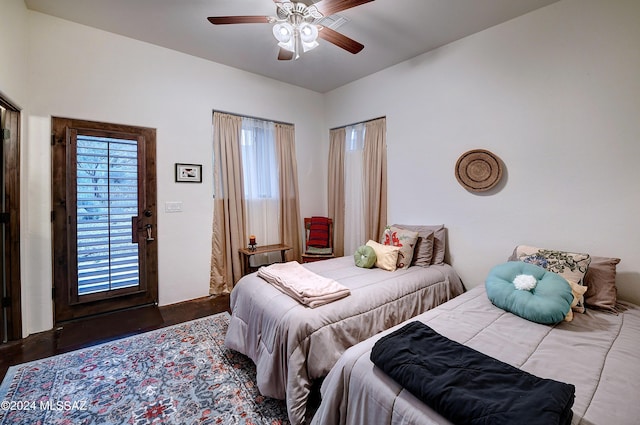 bedroom with a ceiling fan and wood finished floors