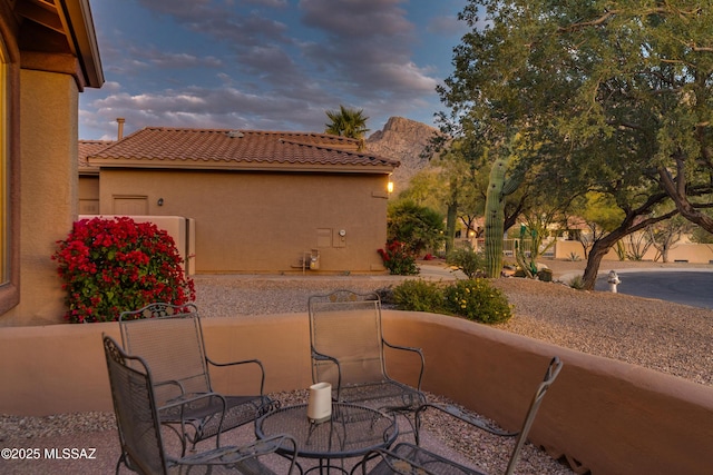 view of patio terrace at dusk