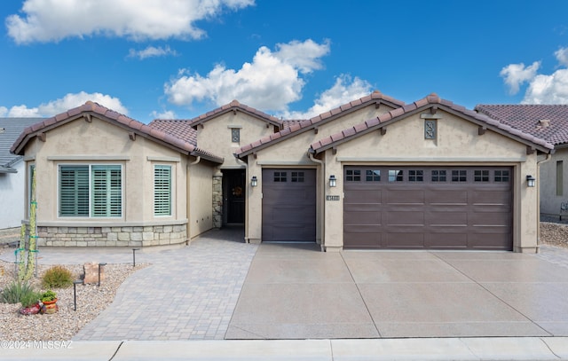 view of front of property with a garage