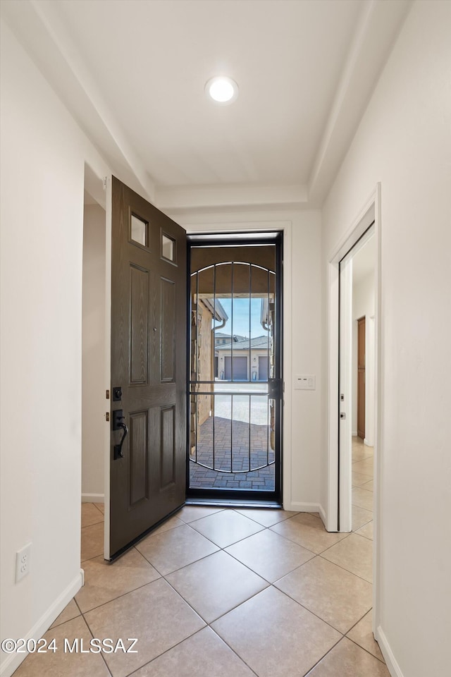 foyer with light tile patterned floors