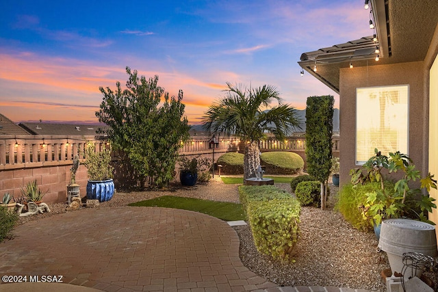 view of patio terrace at dusk