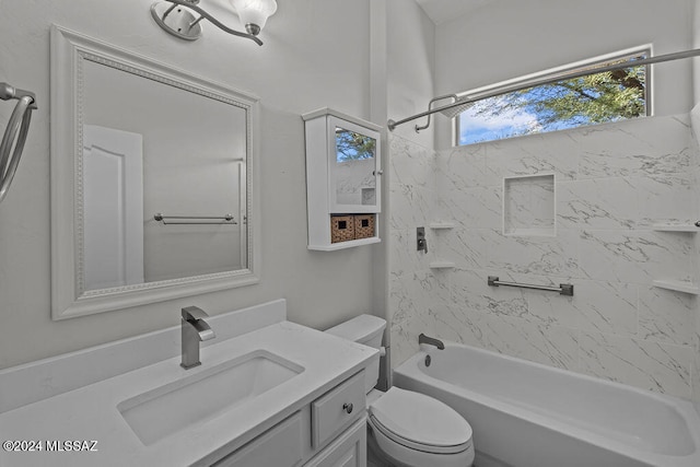 full bathroom with tiled shower / bath, vanity, and toilet