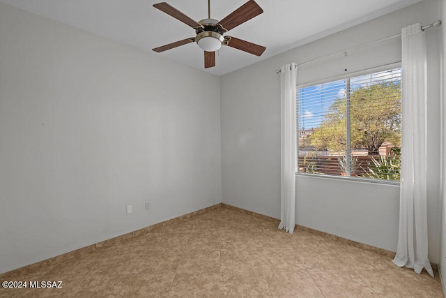 spare room with ceiling fan