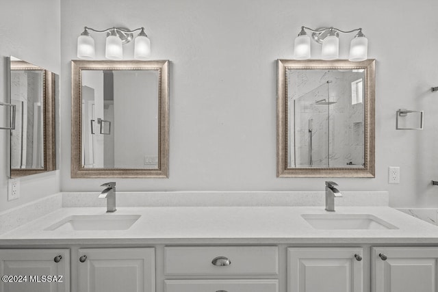 bathroom with walk in shower and vanity