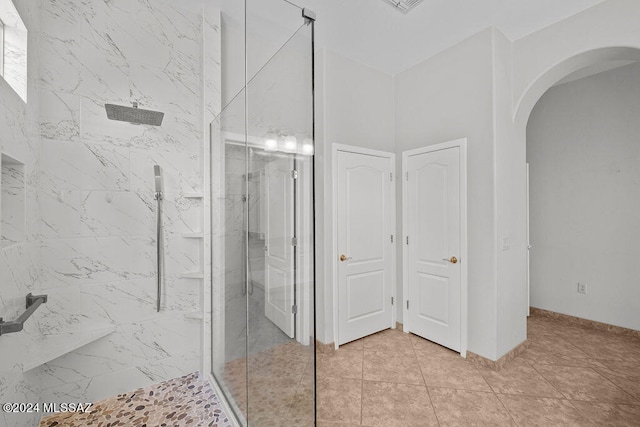 bathroom with tiled shower